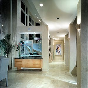 Custom cabinetry, custom glass design, faux finished walls, stone floor