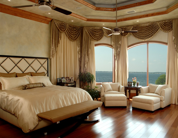 wood floors, custom draperies, upholstered bed