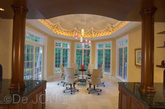 Recessed lighting, perimeter lighting, contemporary chairs, glass table 